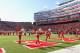 Nebraska cheerleaders and band populate the field prior to the first half of an NCAA college football game against Iowa in Lincoln, Neb., Friday, Nov. 29, 2013. (AP Photo/Nati Harnik)