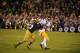 Southern California De'Von Flournoy makes a catch as Notre Dame Bennett Jackson makes the tackle during the 14-10 Notre Dame victory in a game Saturday Oct. 19, 2013 in South Bend, Ind. (AP Photo/Joe Raymond)