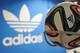 HERZOGENAURACH, GERMANY - DECEMBER 06: Brazuca match balls for the FIFA World Cup 2014 lie in a rack in front of the adidas logo on December 6, 2013 in Scheinfeld near Herzogenaurach, Germany. Brazuca is the Official Match Ball for the FIFA World Cup 2014 Brazil. (Photo by Lennart Preiss/Getty Images for adidas)