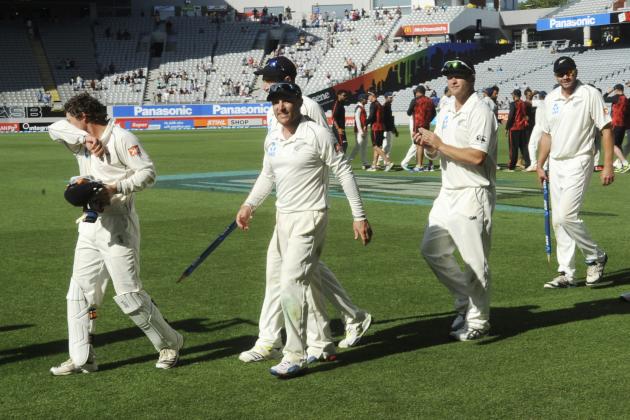 New Zealand’s Brendon McCullum, center, walks with his team after their 40 run defeat of India on the fourth day of the first cricket test at Eden Park in Auckland, New Zealand, Sunday, Feb. 9, 2014. (AP Photo/SNPA, Ross Setford) NEW ZEALAND OUT