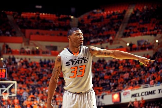 Oklahoma State guard Marcus Smart points during an NCAA college basketball game in Stillwater, Okla., Saturday, Feb. 1, 2014. (AP Photo/Brody Schmidt)