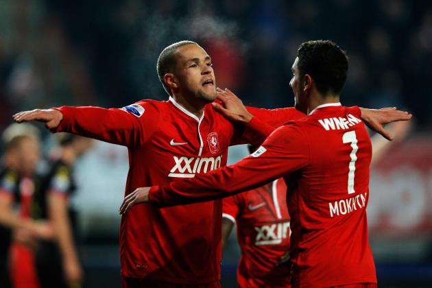 ENSCHEDE, NETHERLANDS - DECEMBER 14: Luc Castaignos of Twente celebrates scoring the second goal of the game with team mate Youness Mokhtar (#7) during the Eredivisie match between FC Twente and Go Ahead Eagles at De Grolsch Veste Stadium on December 14, 2013 in Enschede, Netherlands. (Photo by Dean Mouhtaropoulos/Getty Images)