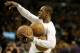Boston Celtics point guard Rajon Rondo (9) holds three balls aqs he takes practice shots before the first half of their NBA basketball game against the Dallas Mavericks in Boston, Sunday, Feb. 9, 2014. The Mavericks defeated the Celtics 102-91. (AP Photo/Stephan Savoia)