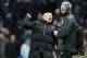 Chelsea's manager Jose Mourinho, left, celebrates victory at the end of the game during their English Premier League soccer match against Manchester City at the Etihad stadium in Manchester, England, Monday Feb. 3, 2014. (AP Photo/Clint Hughes)