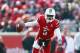 LOUISVILLE, KY - NOVEMBER 23: Teddy Bridgewater #5 of the Louisville Cardinals avoids the tackle of Chase Rome #47 of the Memphis Tigers at Papa John's Cardinal Stadium on November 23, 2013 in Louisville, Kentucky. (Photo by Andy Lyons/Getty Images)