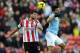 SUNDERLAND, ENGLAND - NOVEMBER 10: Ondrej Celustka of Sunderland in action with Sergio Aguero of Manchester City during the Barclays Premier League match between Sunderland and Manchester City at Stadium of Light on November 10, 2013 in Sunderland, England. (Photo by Chris Brunskill/Getty Images)