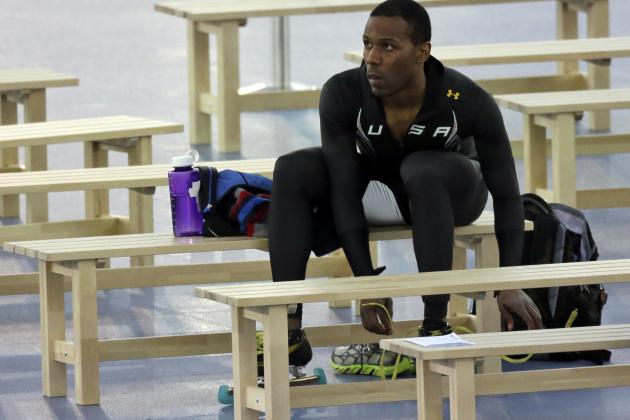 Shani Davis of the U.S. sits on a bench after competing in the men's 1,000-meter speedskating race at the Adler Arena Skating Center during the 2014 Winter Olympics in Sochi, Russia, Wednesday, Feb. 12, 2014. (AP Photo/David J. Phillip )