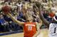 Syracuse's Tyler Ennis (11) shoots after getting past Pittsburgh's Jamel Artis (1) during the second half of an NCAA college basketball game Wednesday, Feb. 12, 2014, in Pittsburgh. (AP Photo/Keith Srakocic)