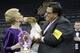 Judge Betty Regina Leininger, left, and handler Gabriel Rangel, pose with Sky, a wire fox terrier, after winning best in show at the Westminster Kennel Club dog show, Tuesday, Feb. 11, 2014, in New York. (AP Photo/Frank Franklin II)