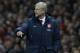 Arsenal's manager Arsene Wenger calls out to his players as he watches his team play against Crystal Palace during their English Premier League soccer match at Emirates Stadium in London, Sunday, Feb. 2, 2014. (AP Photo/Sang Tan)