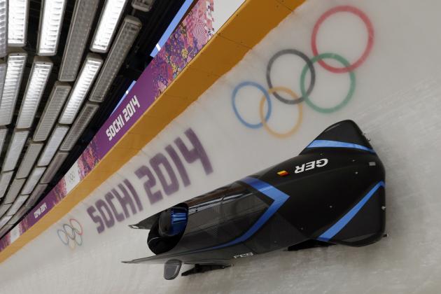 The GER-3 sled from Germany takes a turn during a training run for the two-man bobsled at the 2014 Winter Olympics, Thursday, Feb. 6, 2014, in Krasnaya Polyana, Russia. (AP Photo/Michael Sohn)
