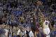 Miami Heat's LeBron James (6) shoots the game winning basket over Golden State Warriors' Andre Iguodala (9) during the second half of an NBA basketball game Wednesday, Feb. 12, 2014, in Oakland, Calif. (AP Photo/Ben Margot)