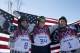 Men's ski slopestyle medalists from the United States Gus Kenworthy, left, silver, Joss Christensen, center, gold, and Nicholas Goepper, bronze, right, pose for photographers at the Rosa Khutor Extreme Park, at the 2014 Winter Olympics, Thursday, Feb. 13, 2014, in Krasnaya Polyana, Russia.(AP Photo/Gero Breloer)