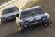 Jimmie Johnson (48) races in front of Dale Earnhardt Jr. during the NASCAR Sprint Cup Series auto race in Homestead, Fla., Sunday, Nov. 17, 2013. (AP Photo/Darryl Graham)