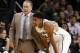 Michigan State head coach Tom Izzo, left, talks to Gary Harris during the first half of a Coaches vs. Cancer NCAA college basketball game against Virginia Tech, Friday, Nov. 22, 2013, in New York. (AP Photo/Frank Franklin II)