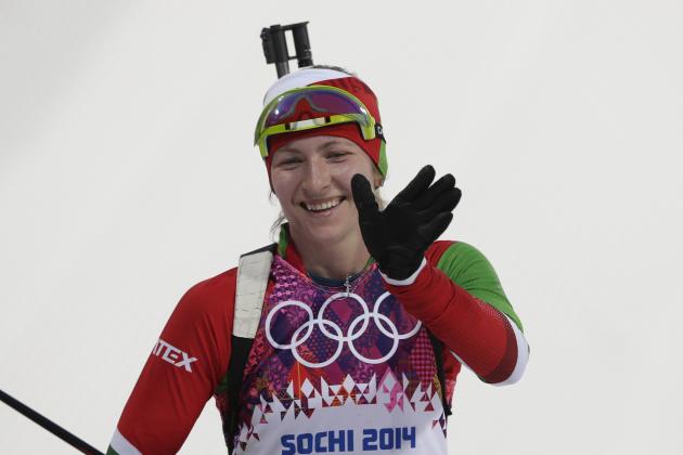 Belarus' Darya Domracheva celebrates winning the gold during the women's 15K individual biathlon race at the 2014 Winter Olympics, Friday, Feb. 14, 2014, in Krasnaya Polyana, Russia. (AP Photo/Matthias Schrader)