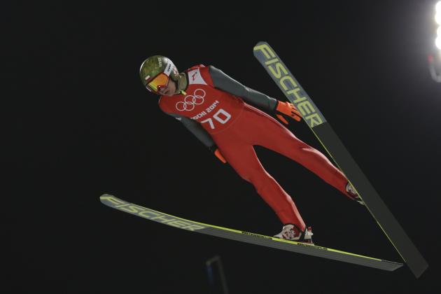 Poland's Kamil Stoch makes an attempt in the men's normal hill ski jumping training at the 2014 Winter Olympics, Thursday, Feb. 6, 2014, in Krasnaya Polyana, Russia. (AP Photo/Matthias Schrader)
