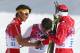 SOCHI, RUSSIA - FEBRUARY 14: Gold medalist Dario Cologna (R) of Switzerland applauds Dachhiri Sherpa (L) of Nepal and Roberto Carcelen (C) of Peru after competing in the Men's 15 km Classic during day seven of the Sochi 2014 Winter Olympics at Laura Cross-country Ski & Biathlon Center on February 14, 2014 in Sochi, Russia. (Photo by Paul Gilham/Getty Images)