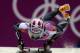 Noelle Pikus-Pace of the United States starts her final run during the women's skeleton competition at the 2014 Winter Olympics, Friday, Feb. 14, 2014, in Krasnaya Polyana, Russia. Pikus-Pace won the silver medal. (AP Photo/Natacha Pisarenko)