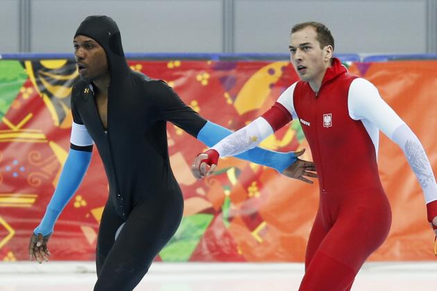 Shani Davis of the U.S., left, congratulates gold medallist  Poland's Zbigniew Brodka after their race in the men's 1,500-meter speedskating during the 2014 Winter Olympics in Sochi, Russia, Saturday, Feb. 15, 2014. Verweij lost the gold medal by three thousandth of a second. (AP Photo/Pavel Golovkin)