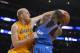 Los Angeles Lakers center Chris Kaman, left, fouls Oklahoma City Thunder power forward Serge Ibaka, of Congo, during the second half of an NBA basketball game, Thursday, Feb. 13, 2014, in Los Angeles. (AP Photo/Mark J. Terrill)