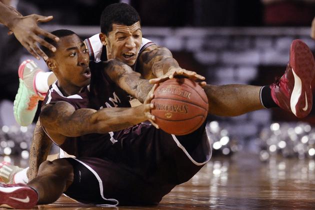 Fordham's Mandell Thomas, left, and Massachusetts' Maxie Esho, battle for control of the ball during the first half of an NCAA college basketball game, Sunday, Jan. 26, 2014, in Amherst, Mass. (AP Photo/Jessica Hill)
