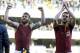 AS Roma's Miralem Pjanic, right, of Bosnia, and teammate Daniele De Rossi wave to supporters at the end of a Serie A soccer match at Bentegodi stadium in Verona, Italy, Sunday, Jan. 26, 2014. AS Roma won 3-1. (AP Photo/Felice Calabro')