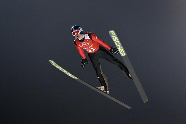 Germany's Richard Freitag soars through the air during men's ski jumping training at the 2014 Winter Olympics, Sunday, Feb. 16, 2014, in Krasnaya Polyana, Russia. (AP Photo/Matthias Schrader)