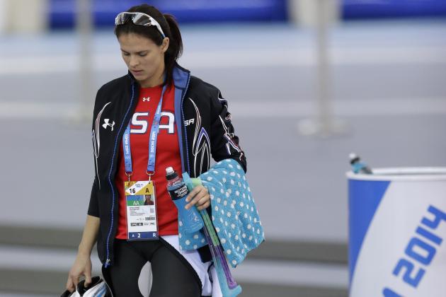 Brittany Bowe of the U.S. walks with her belongings after the women's 1,500-meter speedskating race at the Adler Arena Skating Center during the 2014 Winter Olympics in Sochi, Russia, Sunday, Feb. 16, 2014. (AP Photo/Patrick Semansky)