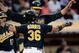 Derek Norris and Nate Freiman meet with a chest bump.