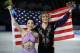 Meryl Davis and Charlie White of the United States pose for photographers after placing first in the ice dance free dance figure skating finals at the Iceberg Skating Palace during the 2014 Winter Olympics, Monday, Feb. 17, 2014, in Sochi, Russia. (AP Photo/Vadim Ghirda)