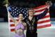 Meryl Davis and Charlie White of the United States pose for photographers after placing first in the ice dance free dance figure skating finals at the Iceberg Skating Palace during the 2014 Winter Olympics, Monday, Feb. 17, 2014, in Sochi, Russia. (AP Photo/Vadim Ghirda)