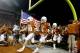 FILE- In this Nov. 22, 2012, file photo, Texas players Kenny Vaccaro (4) and Cedric Reed (88) enter the stadium before the start of an NCAA college football game against TCU in Austin, Texas. Texas has the most valuable college football program in the nation, according to Forbes Magazine. Forbes released its college football evaluations Wednesday, Dec. 19, 2012. The magazine says the Longhorns are worth $133 million, up from $129 million last year. (AP Photo/Jack Plunkett, File)