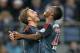 Bayern's Mario Goetze, left, and Bayern's David Alaba of Austria celebrate after the opening goal during the quarterfinal match of the German soccer cup between Hamburger SV and Bayern Munich in Hamburg, Germany, Wednesday, Feb. 12, 2014. (AP Photo/Martin Meissner)