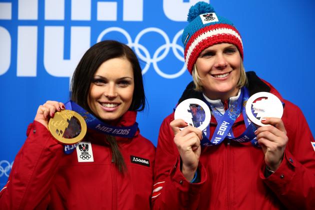 SOCHI, RUSSIA - FEBRUARY 15: Bronze medalist Nicole Hosp (R) of Austria and gold medalist Anna Fenninger of Austria celebrate during the medal ceremony for the Alpine Skiing Ladies' Super-G on day 8 of the Sochi 2014 Winter Olympics at Medals Plaza on February 15, 2014 in Sochi, Russia.  (Photo by Clive Mason/Getty Images)