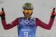 Poland's Kamil Stoch raises his arms after his second attempt during the ski jumping large hill team competition at the 2014 Winter Olympics, Monday, Feb. 17, 2014, in Krasnaya Polyana, Russia. (AP Photo/Matthias Schrader)