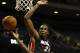Oct 10, 2013; Auburn Hills, MI, USA; Detroit Pistons point guard Will Bynum (12) gets fouled by Miami Heat power forward Jarvis Varnado (24) during the fourth quarter at The Palace of Auburn Hills. Heat beat the Pistons 112-107. Mandatory Credit: Raj Mehta-USA TODAY Sports