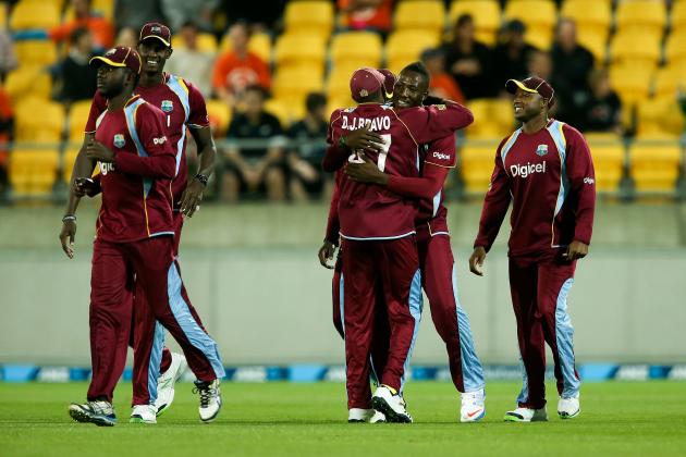 WELLINGTON, NEW ZEALAND - JANUARY 15:  Andre Russell and Dwayne Bravo of the West Indies celebrate the wicket of Corey Anderson of New Zealand during the game two of the Twenty20 series between New Zealand and the West Indies at Westpac Stadium on January 15, 2014 in Wellington, New Zealand.  (Photo by Hagen Hopkins/Getty Images)