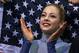 FILE - In a Sunday, Feb. 9, 2014 file photo, Gracie Gold of the United States applauds in the results area after competing in the women's team free skate figure skating competition during the 2014 Winter Olympics, in Sochi, Russia. Some Olympians are turning over their social media accounts to sponsors, agreeing to quotas of postings on Twitter and Facebook and letting other people send commercial messages in their name. The agents for US figure skaters Gold and Ashley Wagner both say sponsors draft some of their tweets, plugging their brands. (AP Photo/Darron Cummings, Pool)