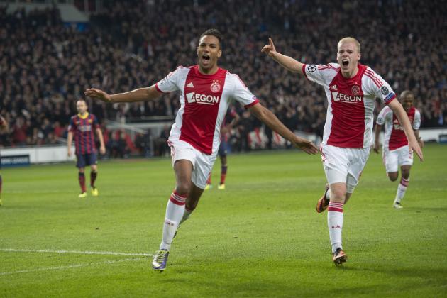 Ajax's Danny Hoesen celebrates after scoring to take the score to 2-0, with Davy Klaassen right, during the Group H Champions League soccer match between Ajax and FC Barcelona at the ArenA stadium in Amsterdam, Netherlands, Tuesday Nov. 26, 2013. (AP Photo/Patrick Post)