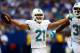 Sep 15, 2013; Indianapolis, IN, USA; Miami Dolphins cornerback Brent Grimes (21) celebrates with teammate after intercepting a pass during the third quarter against the Indianapolis Colts at Lucas Oil Stadium. Mandatory Credit: Andrew Weber-USA TODAY Sports