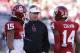 Oklahoma Defensive Coordinator Mike Stoops, center, talks with Zach Sanchez, left, and Aaron Colvin, right, before the start of an NCAA college football game against TCU on Saturday, Oct. 5, 2013, in Norman, Okla. (AP Photo/Alonzo Adams)
