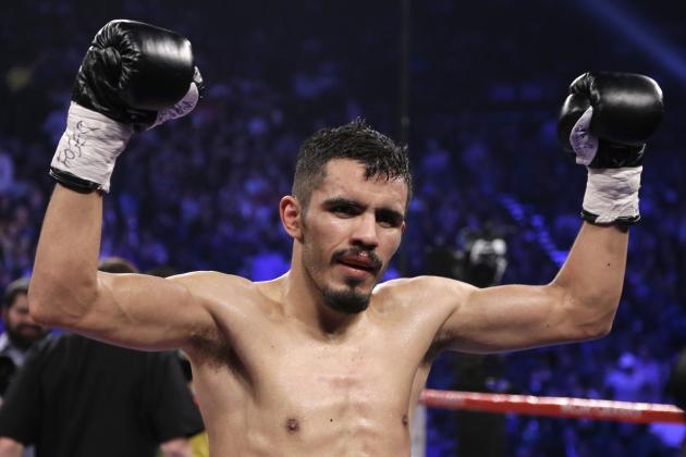 Miguel Angel Vazquez, from Mexico, celebrates his unanimous decision victory over Mercito Gesta, from San Diego, Calif., in their IBF world lightweight title fight Saturday, Dec. 8, 2012, in Las Vegas. (AP Photo/Julie Jacobson)