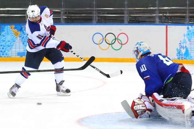 SOCHI, RUSSIA - FEBRUARY 16: Phil Kessel #81 of the United States shoots against Luka Gracnar #40 of Slovenia in the third period during the Men's Ice Hockey Preliminary Round Group A game on day nine of the Sochi 2014 Winter Olympics at Shayba Arena on February 16, 2014 in Sochi, Russia. (Photo by Martin Rose/Getty Images)