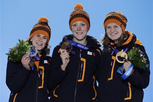 Women's 1,500-meter speedskating medalists, from left, Ireen Wust, silver, Jorien ter Mors, gold, and Lotte van Beek, bronze, all from the Netherlands, pose with their medals at the 2014 Winter Olympics in Sochi, Russia, Monday, Feb. 17, 2014.  (AP Photo/Morry Gash)