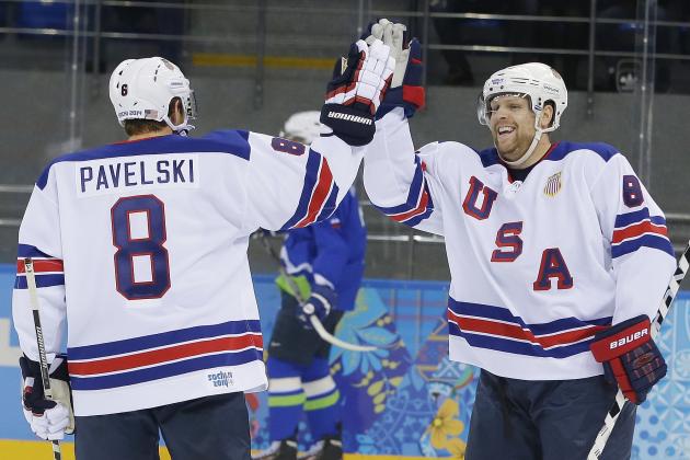USA forward Phil Kessel, right, celebrates his second goal with teammate Joe Pavelski during the 2014 Winter Olympics men's ice hockey game against Slovenia at Shayba Arena Sunday, Feb. 16, 2014, in Sochi, Russia. (AP Photo/Matt Slocum)