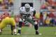 Kansas State offensive linesman Cornelius Lucas (78) gets set on the line of scrimmage during the first half of an NCAA college football game against Iowa State, Saturday, Oct. 13, 2012, in Ames, Iowa. (AP Photo/Charlie Neibergall)