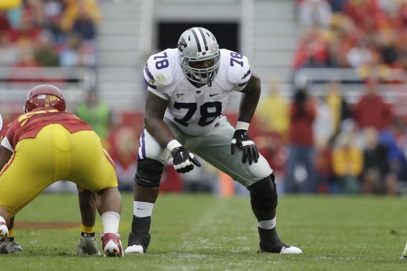 Kansas State offensive linesman Cornelius Lucas (78) gets set on the line of scrimmage during the first half of an NCAA college football game against Iowa State, Saturday, Oct. 13, 2012, in Ames, Iowa. (AP Photo/Charlie Neibergall)