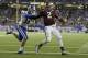 Texas A&M quarterback Johnny Manziel (2) scores a touchdown as Duke safety Jeremy Cash (16) defends in the second half of the Chick-fil-A Bowl NCAA college football game Tuesday, Dec. 31, 2013, in Atlanta. (AP Photo/John Bazemore)