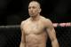 Georges St. Pierre, of Canada, waits to begin a UFC 167 mixed martial arts championship welterweight bout against Johny Hendricks on Saturday, Nov. 16, 2013, in Las Vegas. St. Pierre won by split decision. (AP Photo/Isaac Brekken)